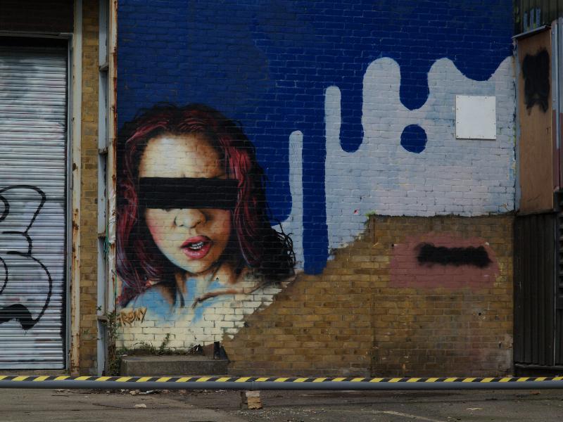 Cambridge, England: Harvest Way: girl (partly blacked out)