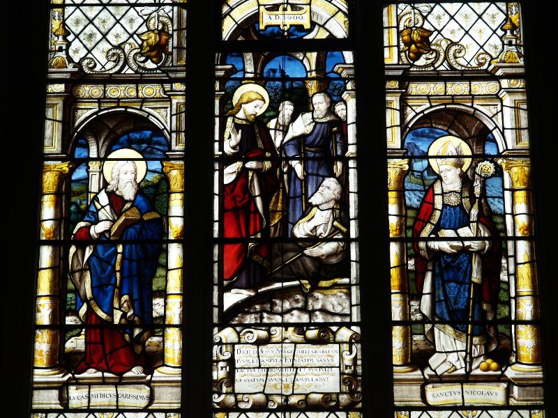 Cambridge, England: Gonville and Caius College: chapel, Christ healing a paralytic, flanked by St Luke and St Nicholas (commemorating George Paget, died 1892)
