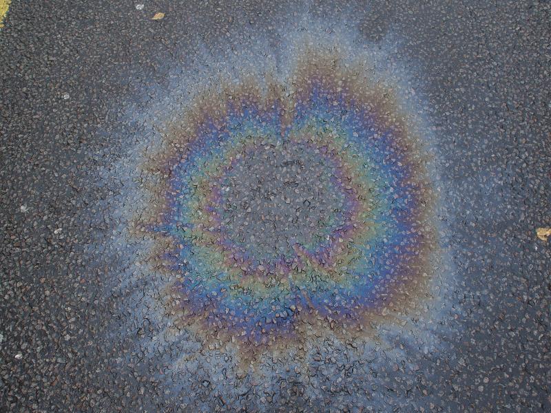 Cambridge, England: Carlyle Road: oil slick on road