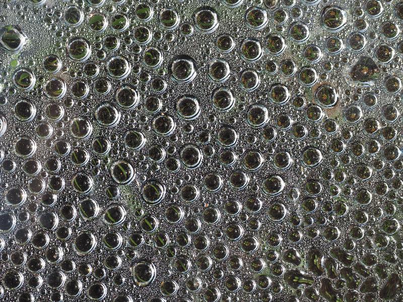 Cambridge, England: Roseford Road: water drops on plexiglass