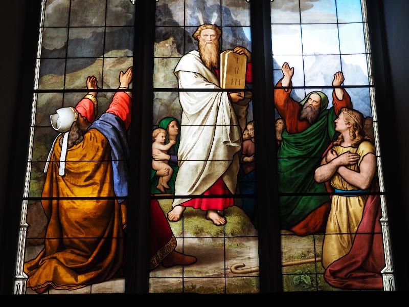 Cambridge, England: Peterhouse: chapel stained glass window, Moses and Ten Commandments (1850s, overall design by Max Emanuel Ainmiller, figures largely work of Claudius Schraudolph and Heinrich von Hess, Royal School of Glass Painting, Munich)