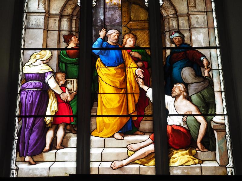 Cambridge, England: Peterhouse: chapel stained glass window, St Peter and blind beggar (1850s, overall design by Max Emanuel Ainmiller, figures largely work of Claudius Schraudolph and Heinrich von Hess, Royal School of Glass Painting, Munich)