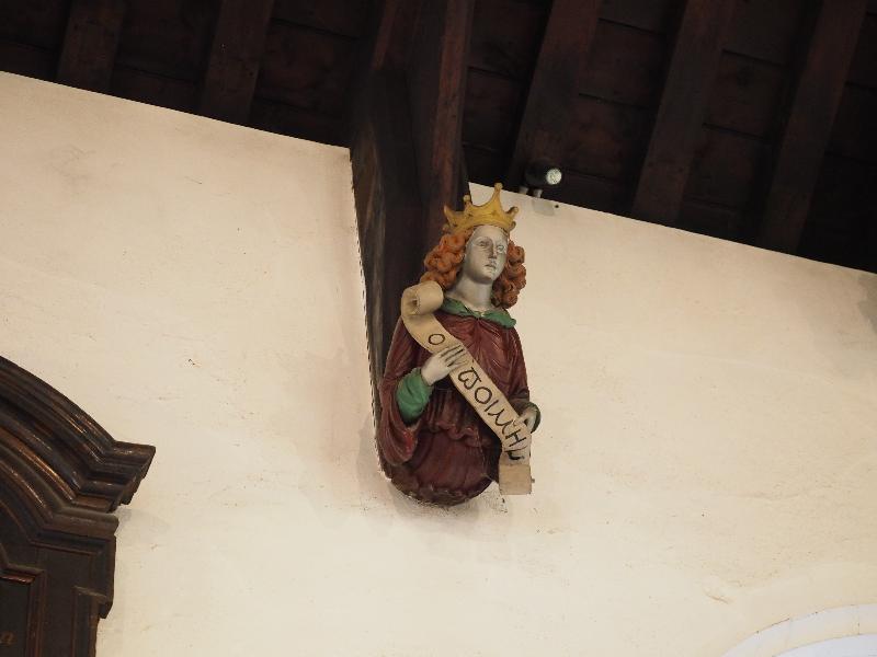 Cambridge, England: St Bene't's Church: ceiling support head