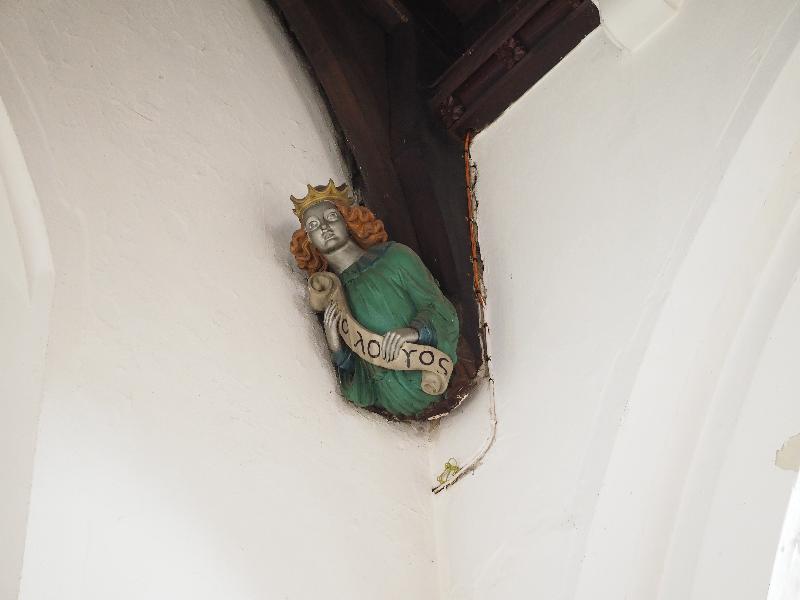 Cambridge, England: St Bene't's Church: ceiling support head