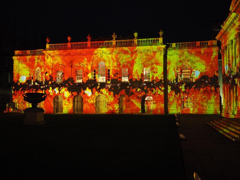 Cambridge, England: Old Schools: red/yellow fire (eLuminate Cambridge Festival, SPIRITUS - Light and Darkness, by Ross Ashton and Karen Monid)