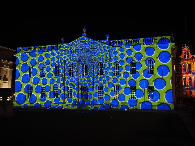 Cambridge, England: Senate House: blue dots on green background (e-Luminate 2018, I see, artist Ross Ashton)