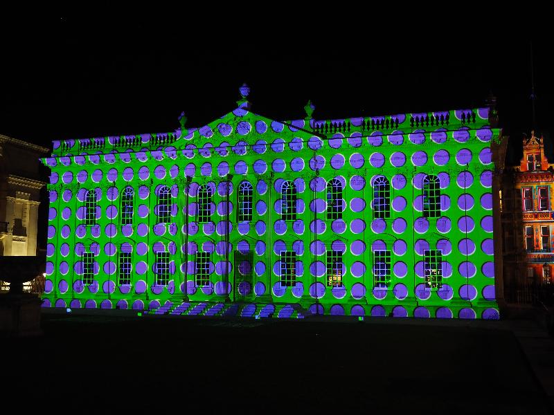 Cambridge, England: Senate House: purple dots on green background (e-Luminate 2018, I see, artist Ross Ashton)