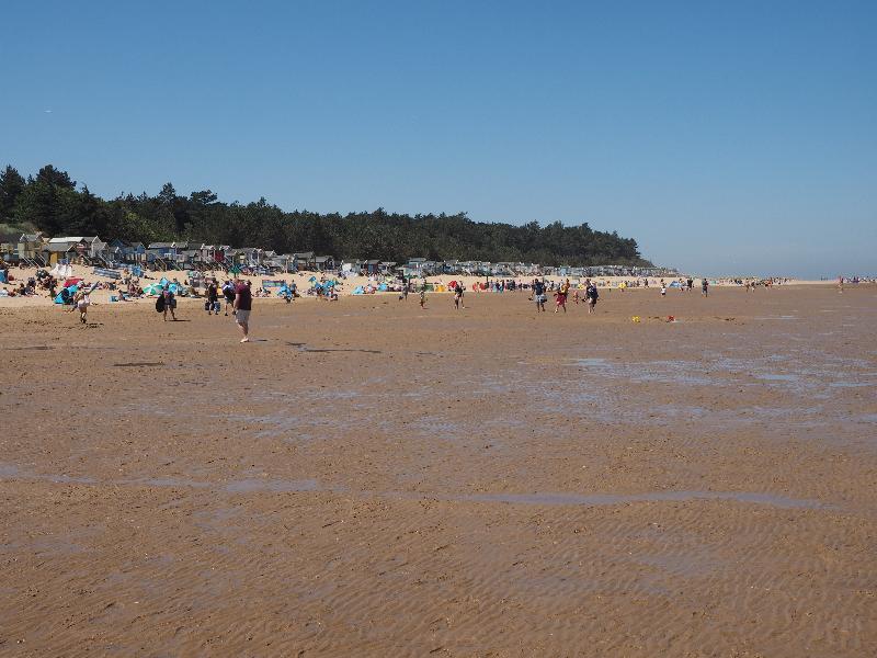 Wells-next-the-Sea, England: beach: beach huts at low tide