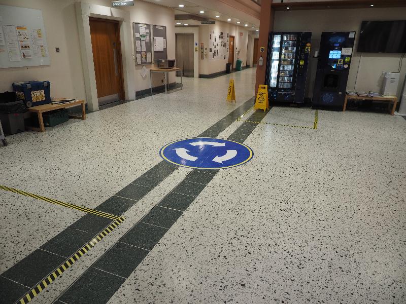 Cambridge, England: Department of Biochemistry: Covid-19 roundabout on floor