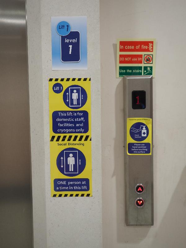 Cambridge, England: Department of Biochemistry: Covid-19 signage at lift