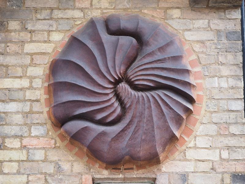 Cambridge, England: Cambridge School of Visual & Performing Arts: sculpture on wall