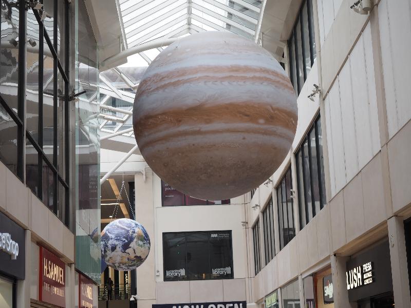 Cambridge, England: Lion Yard: Earth and Jupiter balloons