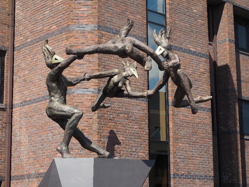 Cambridge, England: Unex House: four dancing figures