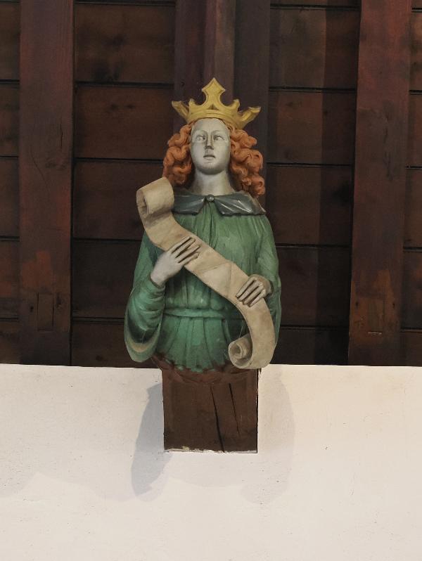 Cambridge, England: St Bene't's Church: north side of north aisle, figure with blank scroll