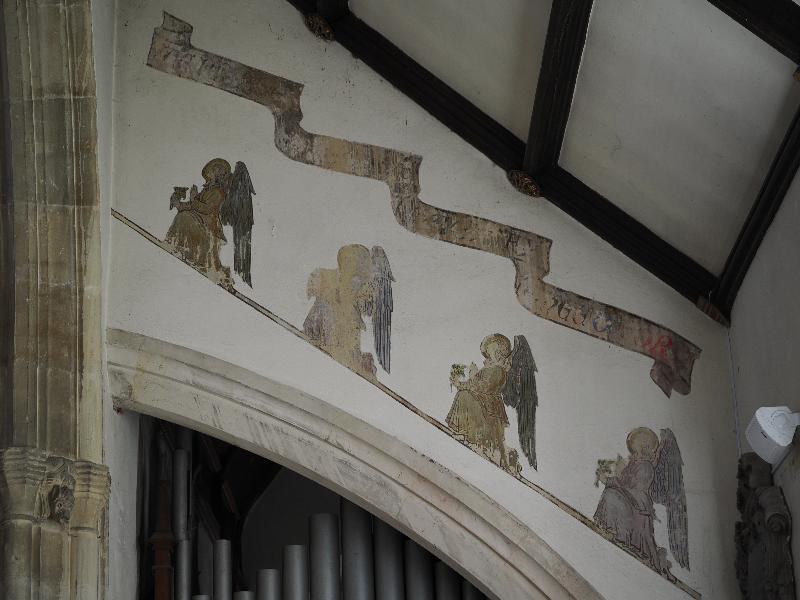 Castle Combe, England: St Andrew's Church: wall decorations, angels praying