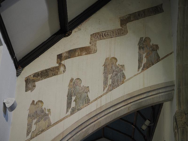 Castle Combe, England: St Andrew's Church: wall decorations, angels praying