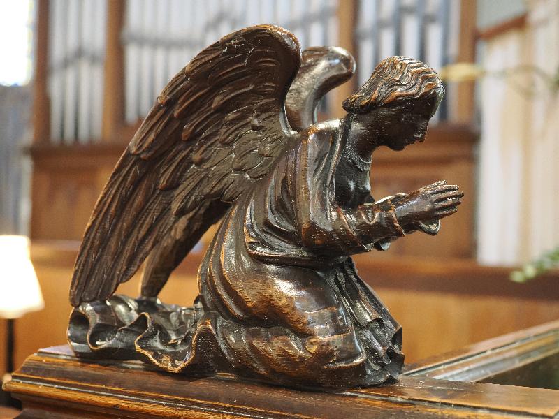 Castle Combe, England: St Andrew's Church: angel carving
