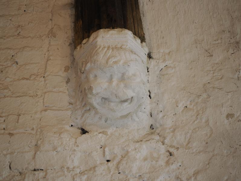 Cambridge, England: Stourbridge Leper Chapel: buttress support, smiling face