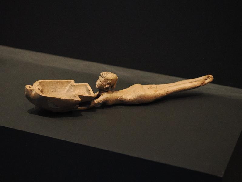 London, England: British Museum: wood spoon in the form of a naked girl swimming with a duck (1550-1069 BC, Egypt)