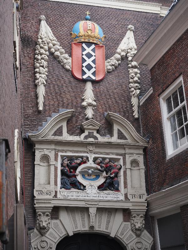 Amsterdam, Netherlands: Amsterdam Orphanage (now Amsterdam Museum): coat-of-arms of Amsterdam, and below that a relief of orphans (1581, Joost Jansz Bilhamer)
