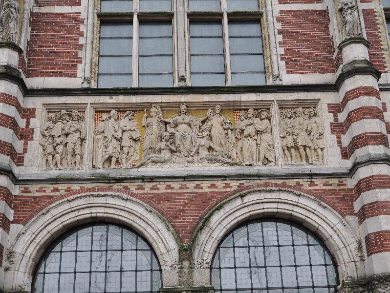 Amsterdam, Netherlands: Rijksmuseum: relief, northeast entrance, central
