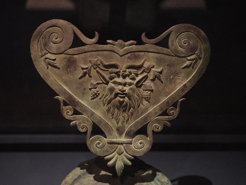London, England: Royal Academy: Double Wick Lamp with a Mask of Pan (first century AD, Roman, Villaneuva del Trabuco, Malaga), detail