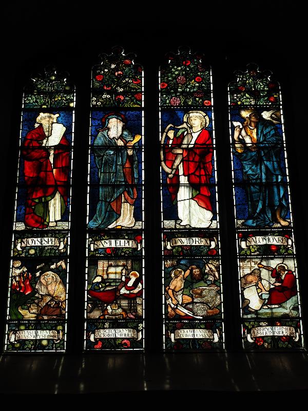 Cambridge, England: Jesus College: chapel, nave, south wall, west window (Moses / Samuel / David / Solomon // Moses and the Burning Bush / Samuel and Eli / David and Goliath / Solomon building the Temple, 1872, Morris & Co)