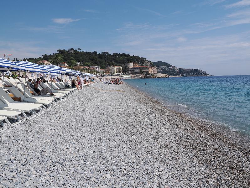 Nice, France: beach: view east towards Colline du Chateau