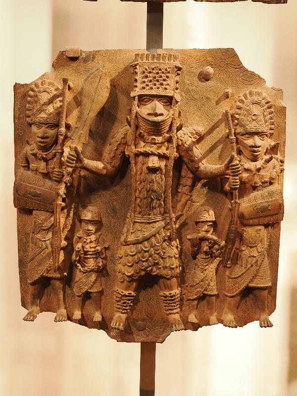 London, England: British Museum: cast brass plaque, three large men and two small men (16th century, Benin, Nigeria)