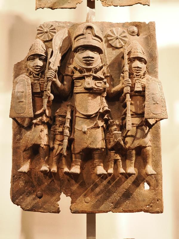 London, England: British Museum: cast brass plaque, three large men and two small men (16th century, Benin, Nigeria)