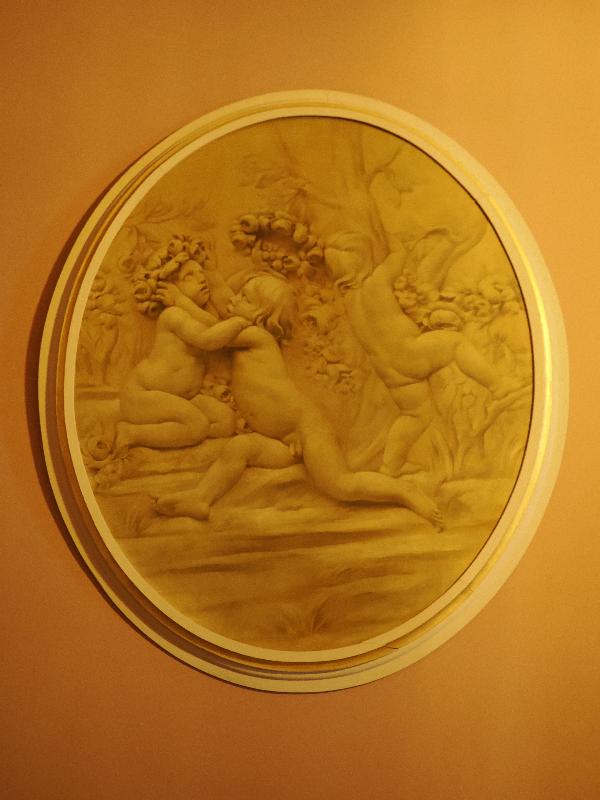 Wimpole, England: Wimpole Hall: hall art, babies with wreaths