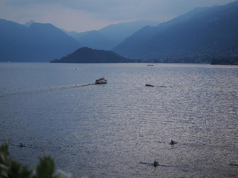 Bellagio, Italy: public garden next to lake: view across lake at dusk