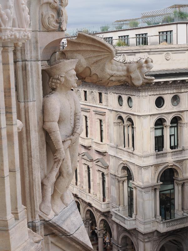 Milan, Italy: Duomo di Milano: garoyle and figure of man