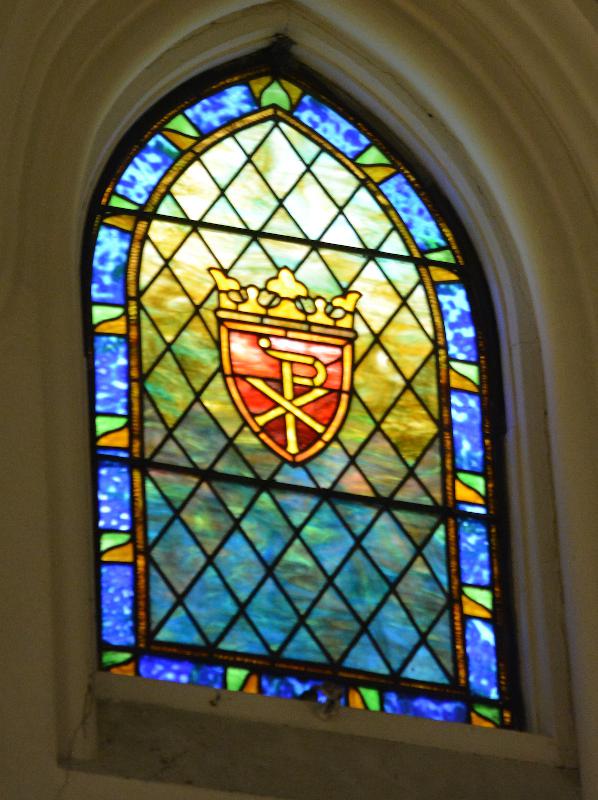 three ornamental windows, one larger and two smaller