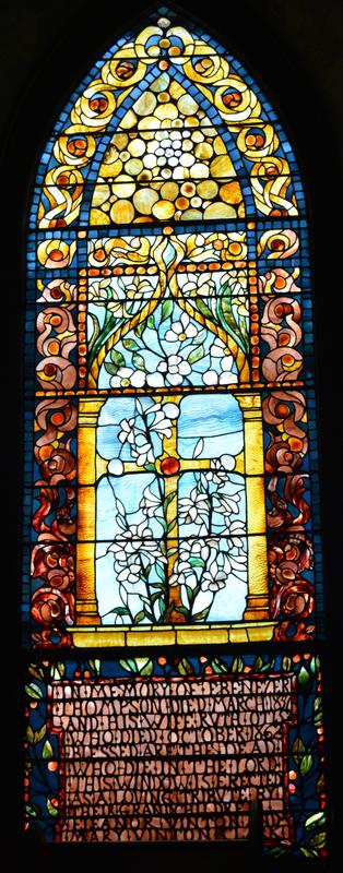 Thompson Memorial Window:  gold cross surrounded by sprays of the Annunciation lily
