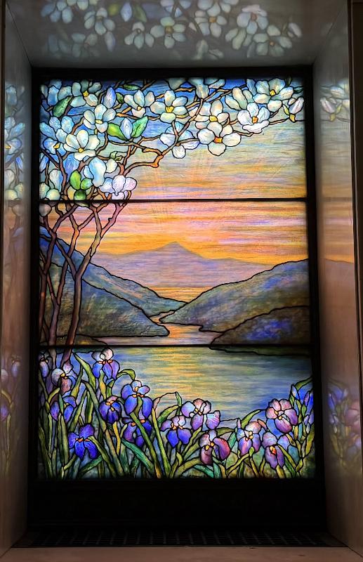 Hills Memorial Window:  landcape with magnolia at left, mountains, water and irises