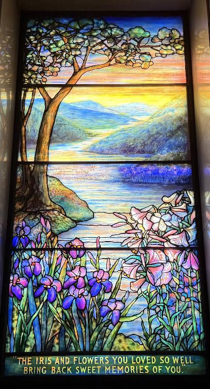 Vehon Memorial Window:  landscape with mountains, water, irises and lilies
