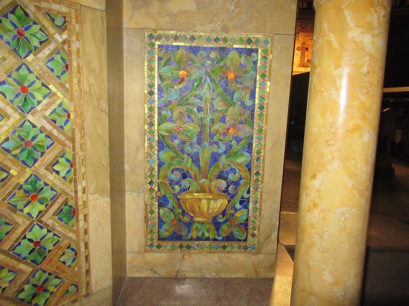 pulpit in colored marble and mosaic with a brass rail