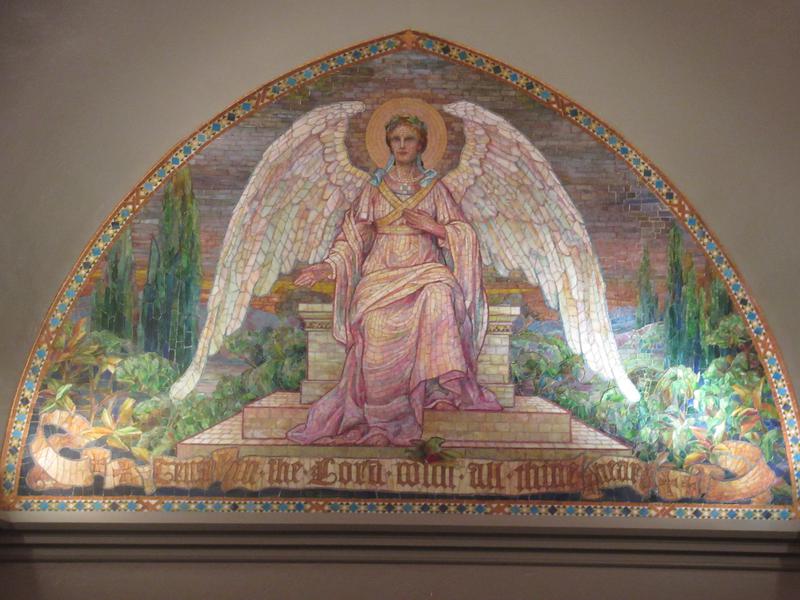 Brush Memorial Mosaic:  angel with a golden aureole against a background of hills and trees