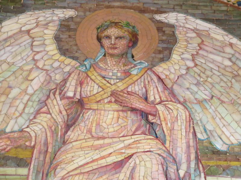 Brush Memorial Mosaic:  angel with a golden aureole against a background of hills and trees