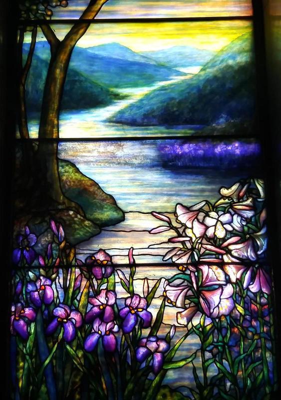 Vehon Memorial Window:  landscape with mountains, water, irises and lilies