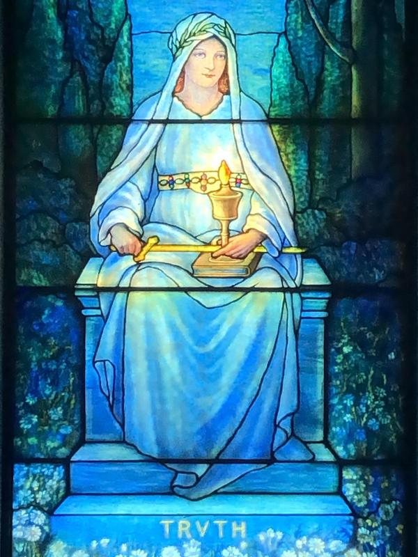 Edward F. Swift Memorial Window:  seated female holding sword and burning lamp