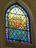 three ornamental windows, one larger and two smaller