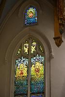 three ornamental windows, one larger and two smaller