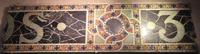 fragments of Tiffany Studios building signage