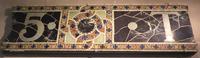 fragments of Tiffany Studios building signage