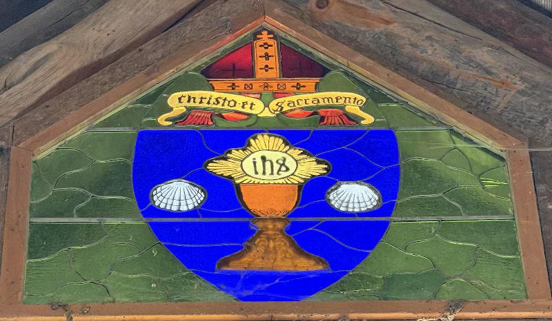 Porter Commemorative Window:  seal of the Episcopal Diocese of Sacramento consisting of a golden chalice on a shield of blue flanked by two silver shells