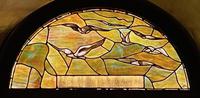 New York, New York City, Manhattan, Church of the Transfiguration: Carrington Commemorative Window:  lunette done in shades of soft amber and green, showing a bird in flight